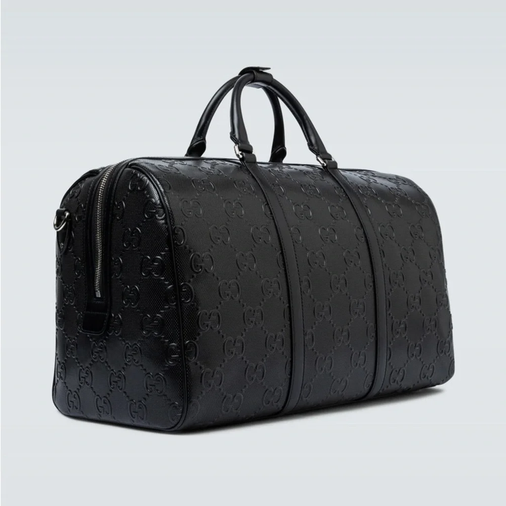 New! Gucci GG embossed black leather duffel bag